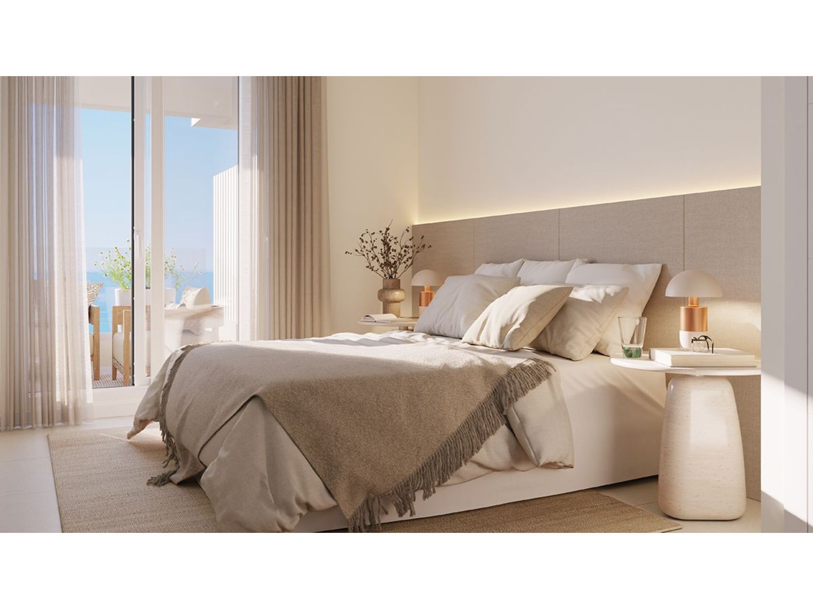 Slaapkamer met balkon en zeezicht